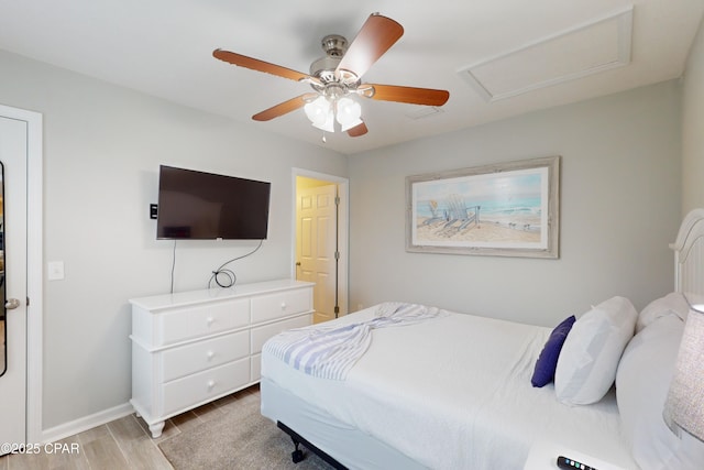 6128 Loquat St, Panama City Beach, FL 32408 - bedroom with light wood-type flooring, attic access, baseboards, and ceiling fan