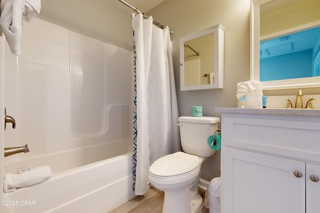 6128 Loquat St, Panama City Beach, FL 32408 - bathroom featuring toilet, shower / tub combo with curtain, wood finished floors, and vanity
