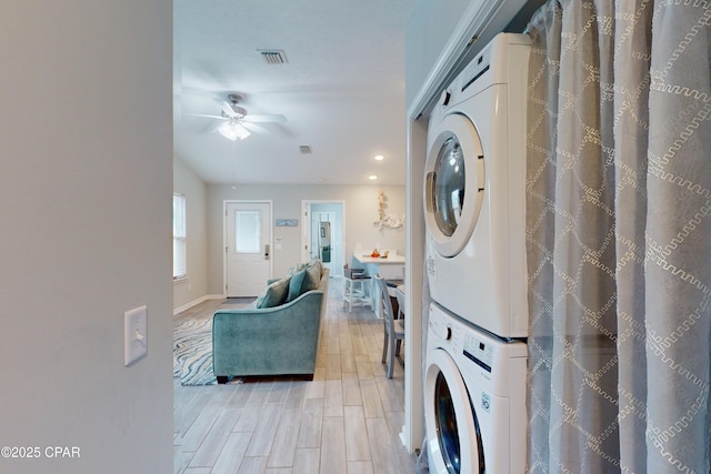 6128 Loquat St, Panama City Beach, FL 32408 - laundry area with stacked washing machine and dryer, a ceiling fan, light wood-type flooring, baseboards, and recessed lighting