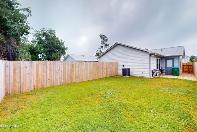 6128 Loquat St, Panama City Beach, FL 32408 - view of yard with a patio and central air condition unit