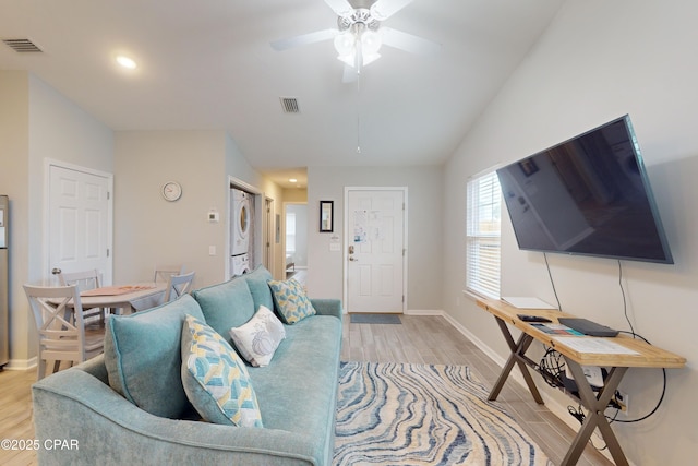 6128 Loquat St, Panama City Beach, FL 32408 - living area with stacked washer / dryer, light wood finished floors, ceiling fan, baseboards, and recessed lighting