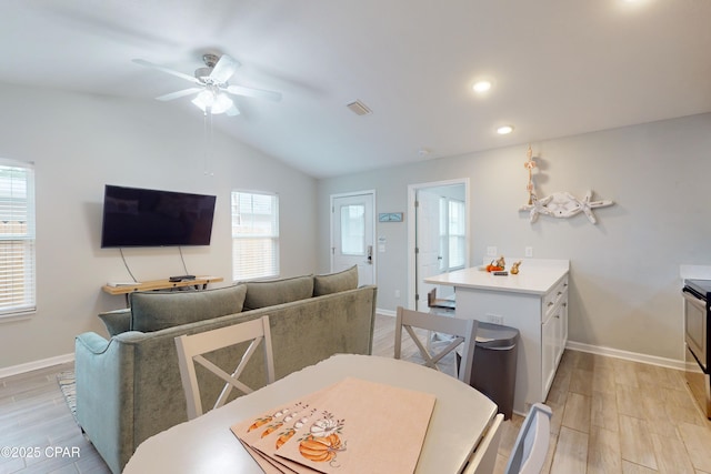 6128 Loquat St, Panama City Beach, FL 32408 - dining space featuring light wood finished floors, ceiling fan, baseboards, recessed lighting, and lofted ceiling