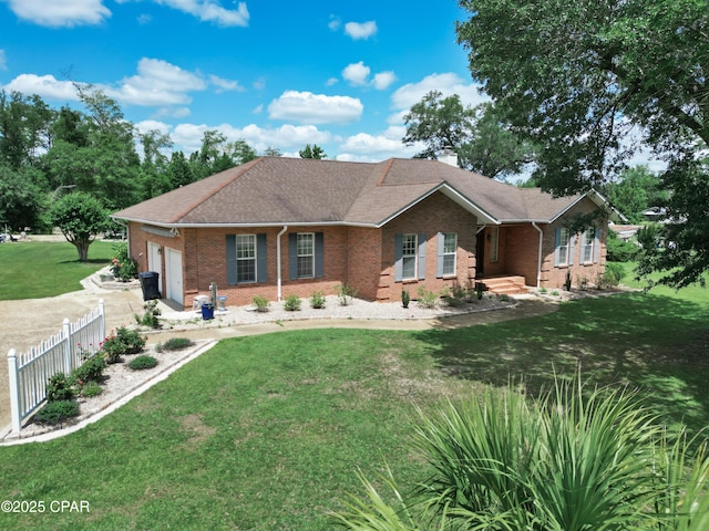 16532 SW Mimosa St, Blountstown, FL 32424 - ranch-style home with an attached garage, brick siding, a chimney, and driveway