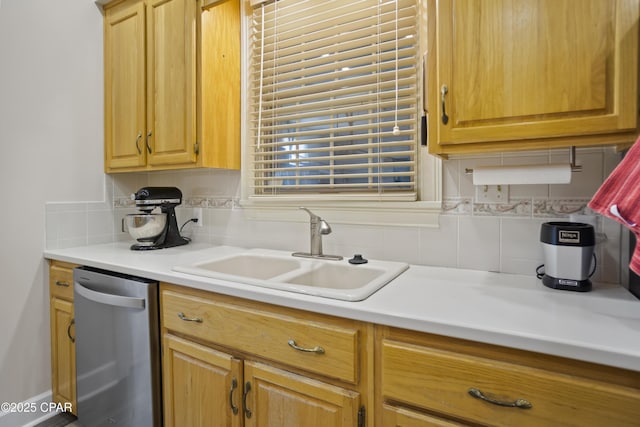 16532 SW Mimosa St, Blountstown, FL 32424 - kitchen with stainless steel dishwasher, a sink, backsplash, and light countertops