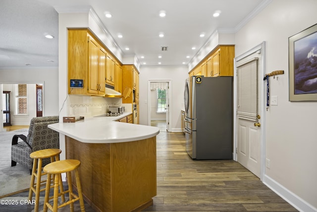 16532 SW Mimosa St, Blountstown, FL 32424 - kitchen featuring freestanding refrigerator, a peninsula, recessed lighting, dark wood finished floors, and light countertops
