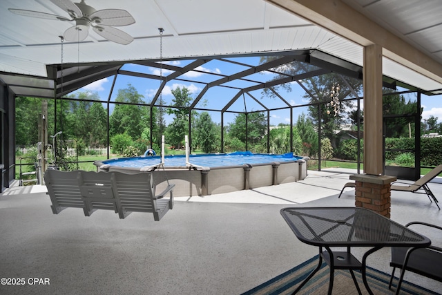 16532 SW Mimosa St, Blountstown, FL 32424 - view of patio / terrace featuring view of wooded area, an outdoor pool, ceiling fan, and a lanai
