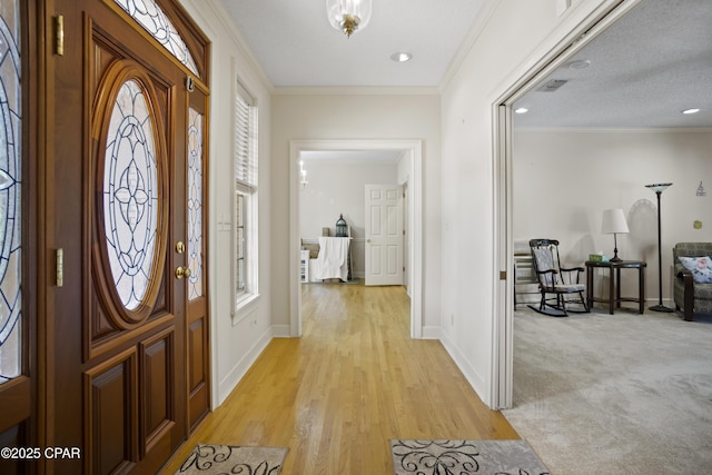 16532 SW Mimosa St, Blountstown, FL 32424 - entryway with baseboards, light wood-style floors, and ornamental molding