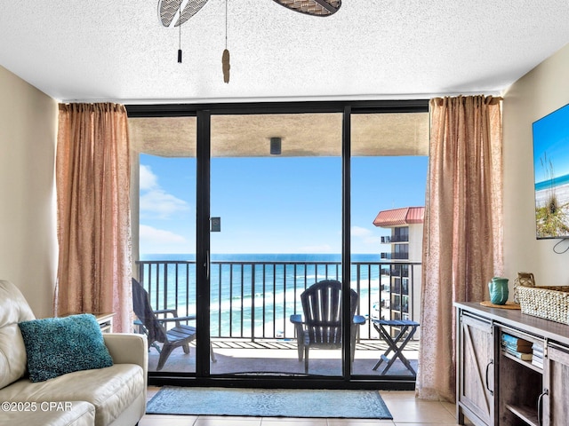 6505 Thomas Dr Unit 1009B, Panama City Beach, FL 32408 - doorway featuring floor to ceiling windows, a textured ceiling, and tile patterned flooring