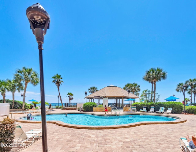 6505 Thomas Dr Unit 1009B, Panama City Beach, FL 32408 - community pool with a patio area, a gazebo, and fence