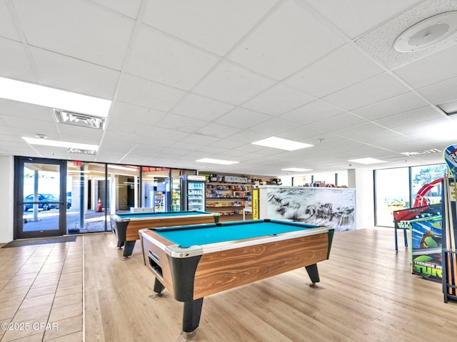 6505 Thomas Dr Unit 1009B, Panama City Beach, FL 32408 - recreation room featuring billiards, healthy amount of natural light, wood finished floors, and a drop ceiling