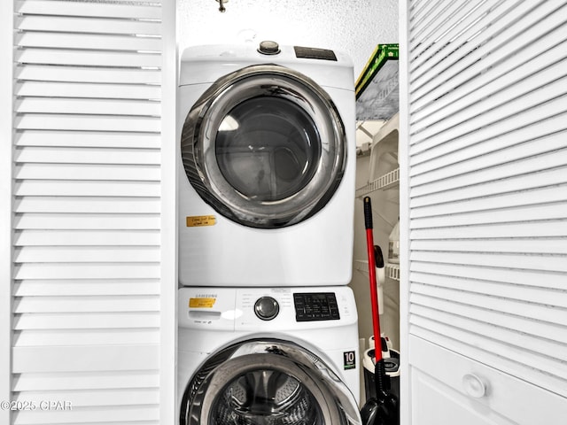 6505 Thomas Dr Unit 1009B, Panama City Beach, FL 32408 - laundry room with stacked washer / drying machine
