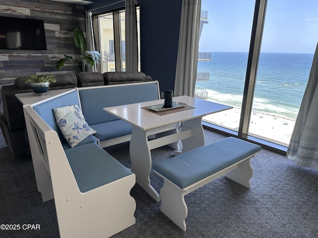 15100 Front Beach Rd Unit 1416, Panama City Beach, FL 32413 - carpeted dining area with healthy amount of natural light, wood walls, and a water view