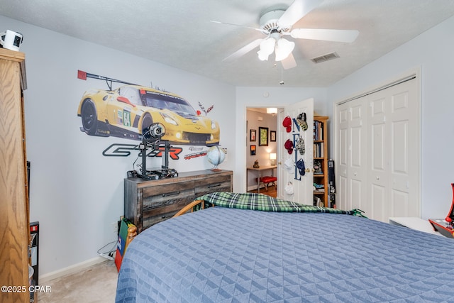 1402 New Hampshire Ave, Lynn Haven, FL 32444 - carpeted bedroom with a closet, baseboards, and a ceiling fan
