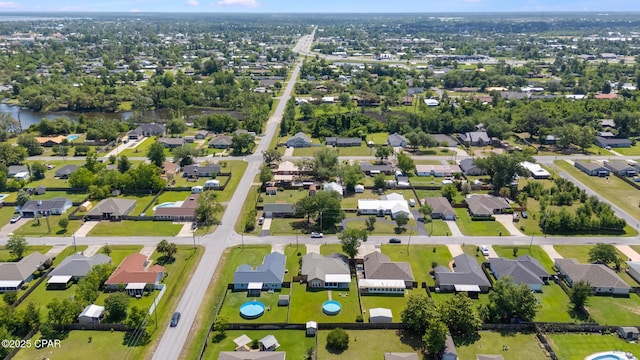 1402 New Hampshire Ave, Lynn Haven, FL 32444 - aerial view of property and surrounding area with nearby suburban area