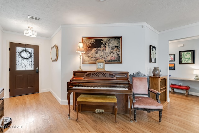1402 New Hampshire Ave, Lynn Haven, FL 32444 - entryway with a textured ceiling, wood finished floors, crown molding, and baseboards