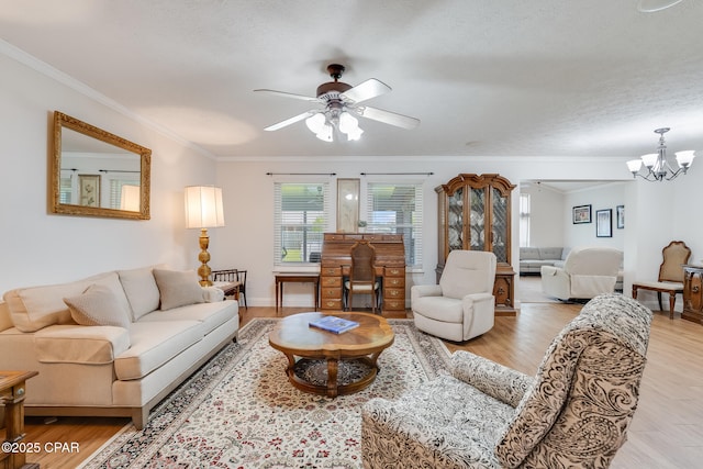 1402 New Hampshire Ave, Lynn Haven, FL 32444 - living room with a ceiling fan, crown molding, a chandelier, and light wood-style flooring