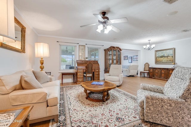1402 New Hampshire Ave, Lynn Haven, FL 32444 - living room featuring light wood finished floors, a chandelier, ornamental molding, and a ceiling fan