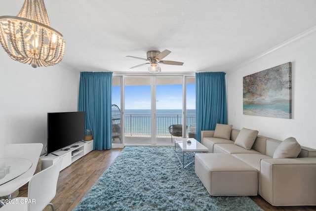 14701 Front Beach Rd Unit 1735, Panama City Beach, FL 32413 - living area featuring floor to ceiling windows, crown molding, ceiling fan, wood finished floors, and a chandelier