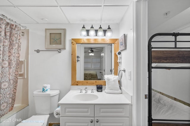 14701 Front Beach Rd Unit 1735, Panama City Beach, FL 32413 - bathroom featuring vanity, toilet, shower / bath combo with shower curtain, a paneled ceiling, and a ceiling fan