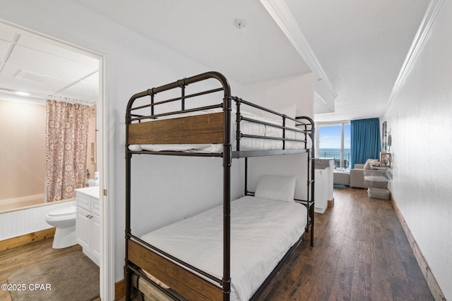 14701 Front Beach Rd Unit 1735, Panama City Beach, FL 32413 - bedroom with wood finished floors, connected bathroom, ornamental molding, and baseboards