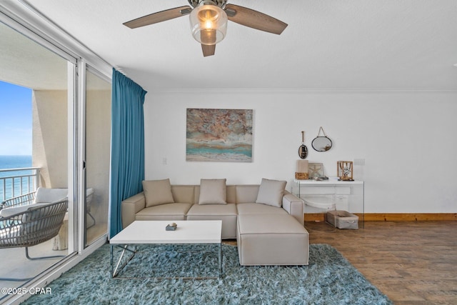 14701 Front Beach Rd Unit 1735, Panama City Beach, FL 32413 - living room featuring a ceiling fan, wood finished floors, baseboards, crown molding, and a water view