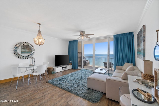 14701 Front Beach Rd Unit 1735, Panama City Beach, FL 32413 - living area featuring crown molding, a ceiling fan, wood finished floors, a chandelier, and floor to ceiling windows