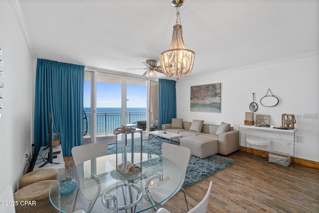 14701 Front Beach Rd Unit 1735, Panama City Beach, FL 32413 - dining space with wood finished floors, ornamental molding, a chandelier, a water view, and a ceiling fan