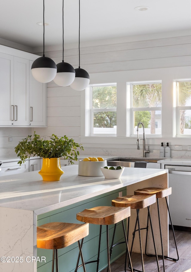 98 Shirah St, Destin, FL 32541 - kitchen featuring stainless steel dishwasher, healthy amount of natural light, and a breakfast bar