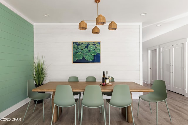98 Shirah St, Destin, FL 32541 - dining room featuring wooden walls, wood finished floors, and recessed lighting