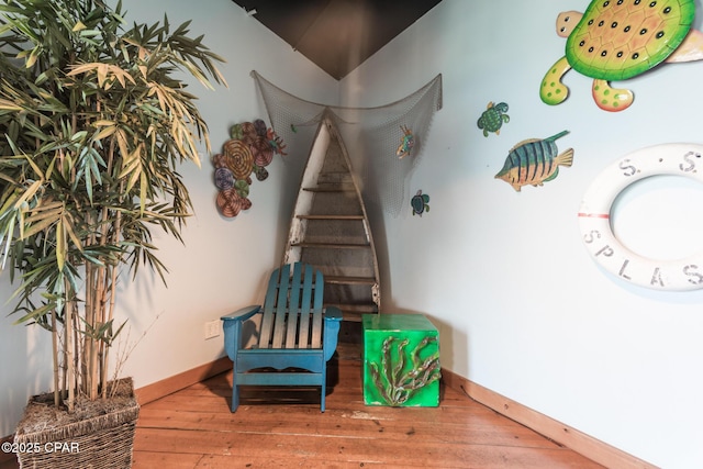 17739 Front Beach Rd Unit 1007W, Panama City Beach, FL 32413 - stairway featuring wood-type flooring and baseboards