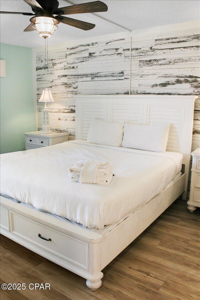 11757 Front Beach Rd Unit W601, Panama City Beach, FL 32407 - bedroom with dark wood-style floors and a ceiling fan