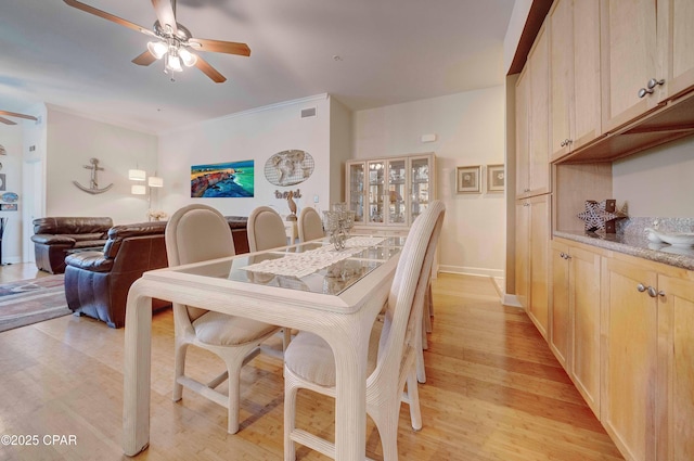 8700 Front Beach Rd Unit 7101, Panama City Beach, FL 32407 - dining space featuring a ceiling fan and light wood-style floors