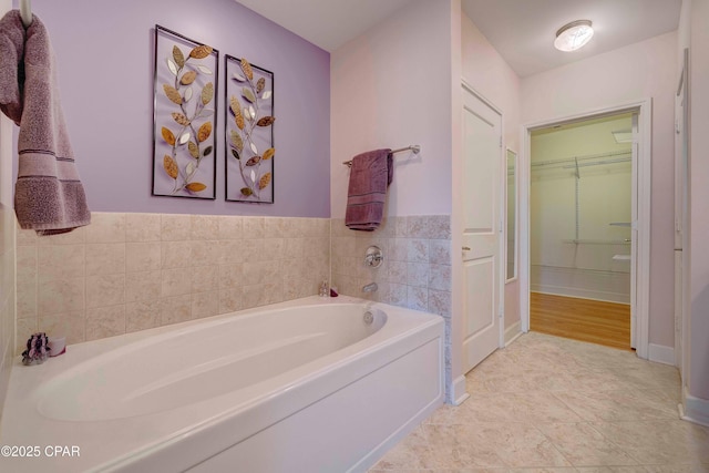 8700 Front Beach Rd Unit 7101, Panama City Beach, FL 32407 - full bath with a bath, a walk in closet, and baseboards