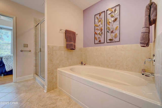 8700 Front Beach Rd Unit 7101, Panama City Beach, FL 32407 - full bath featuring a bath, a shower stall, ensuite bathroom, and tile patterned flooring