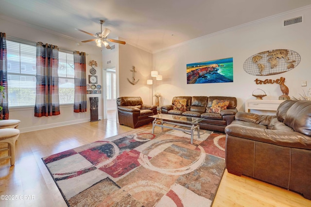8700 Front Beach Rd Unit 7101, Panama City Beach, FL 32407 - living area with wood finished floors, crown molding, ceiling fan, and baseboards