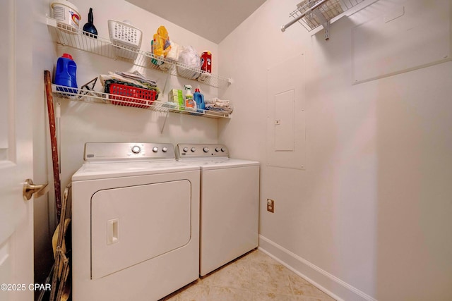 8700 Front Beach Rd Unit 7101, Panama City Beach, FL 32407 - laundry area featuring washer and clothes dryer, light tile patterned flooring, and baseboards