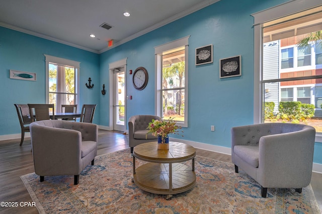 8700 Front Beach Rd Unit 7101, Panama City Beach, FL 32407 - living room with healthy amount of natural light, ornamental molding, baseboards, wood finished floors, and recessed lighting