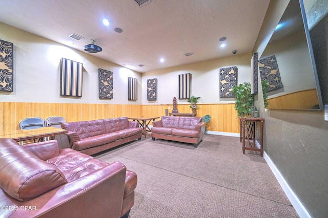8700 Front Beach Rd Unit 7101, Panama City Beach, FL 32407 - home theater room featuring wooden walls, carpet, wainscoting, recessed lighting, and baseboards