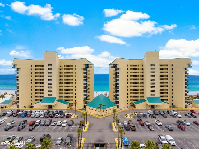 9850 S Thomas Dr Unit 1112E, Panama City Beach, FL 32408 - view of property with a water view and uncovered parking