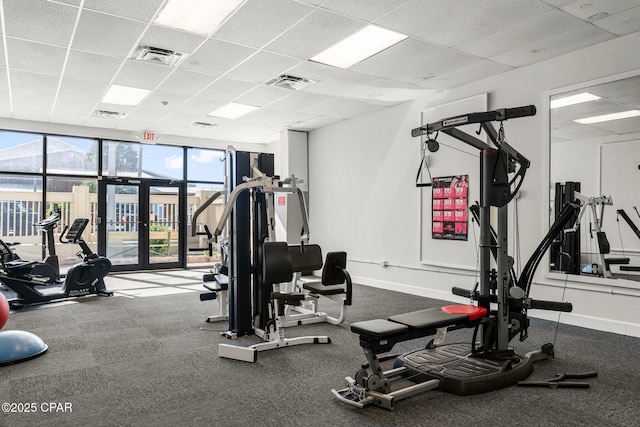 9850 S Thomas Dr Unit 1112E, Panama City Beach, FL 32408 - gym with a paneled ceiling and baseboards