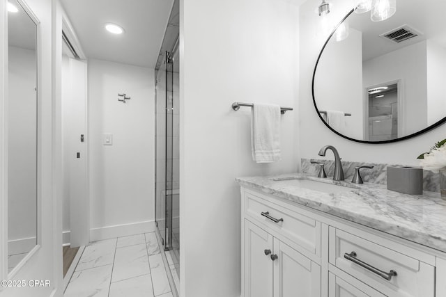 9850 S Thomas Dr Unit 1112E, Panama City Beach, FL 32408 - bathroom with marble look tile flooring, vanity, recessed lighting, baseboards, and an enclosed shower