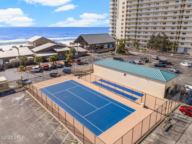 9850 S Thomas Dr Unit 1112E, Panama City Beach, FL 32408 - view of tennis court with a water view