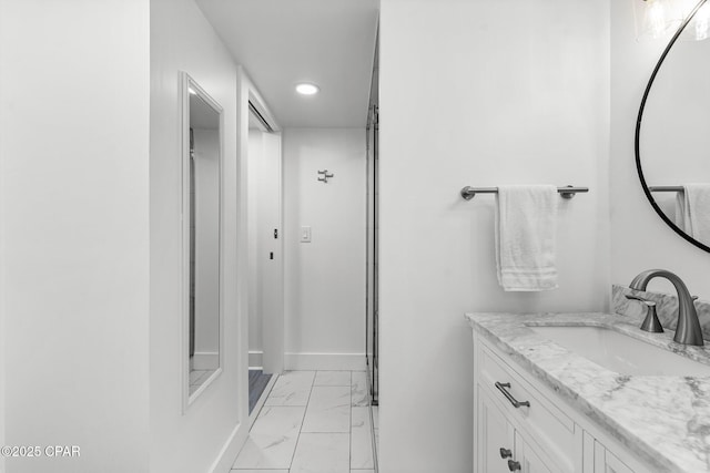 9850 S Thomas Dr Unit 1112E, Panama City Beach, FL 32408 - bathroom featuring marble finish floors, vanity, recessed lighting, and baseboards
