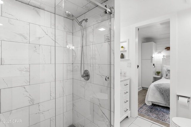 9850 S Thomas Dr Unit 1112E, Panama City Beach, FL 32408 - full bathroom featuring a stall shower, toilet, ensuite bathroom, and vanity