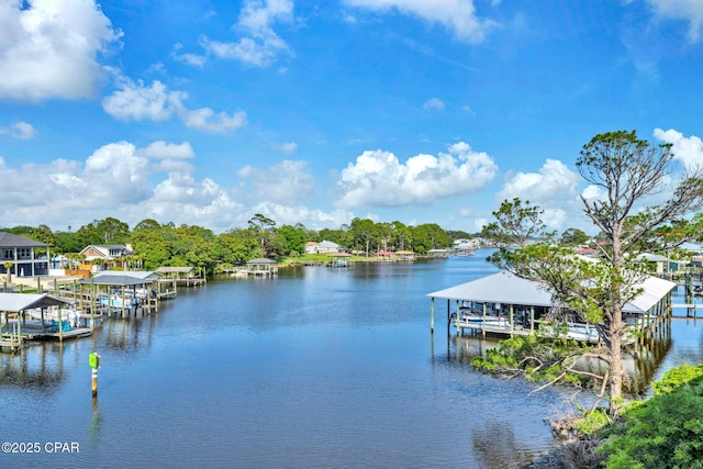 216 Bonita Cir Unit C, Panama City, FL 32408 - dock featuring boat lift and a water view