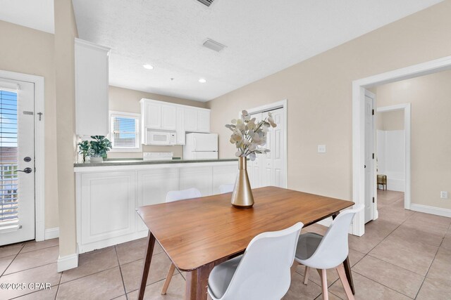 216 Bonita Cir Unit C, Panama City, FL 32408 - dining room with light tile patterned flooring, baseboards, and recessed lighting