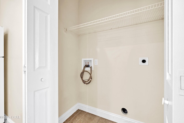 216 Bonita Cir Unit C, Panama City, FL 32408 - washroom featuring washer hookup, light tile patterned floors, hookup for an electric dryer, and baseboards