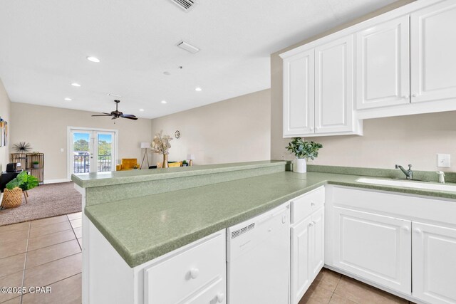 216 Bonita Cir Unit C, Panama City, FL 32408 - kitchen with dishwasher, a peninsula, light tile patterned floors, ceiling fan, and a sink