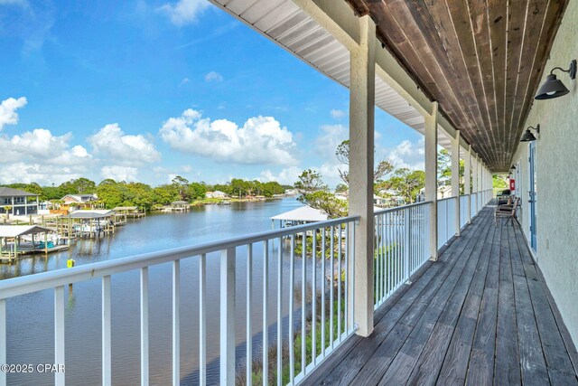 216 Bonita Cir Unit C, Panama City, FL 32408 - wooden terrace with a water view