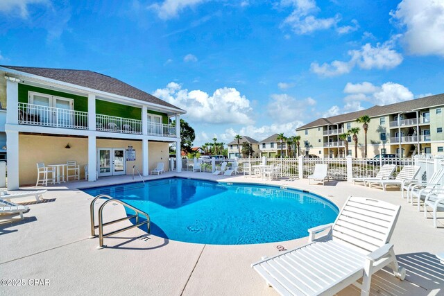 216 Bonita Cir Unit C, Panama City, FL 32408 - community pool with french doors, a patio area, and a residential view